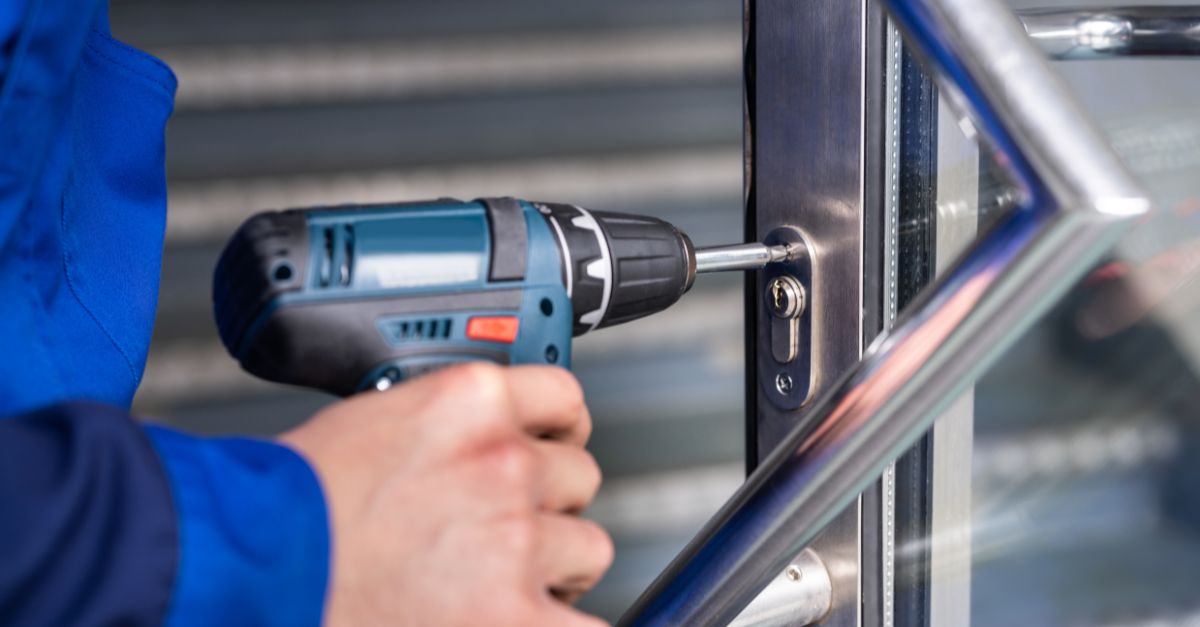 commercial locksmith installing a lock in Melbourne