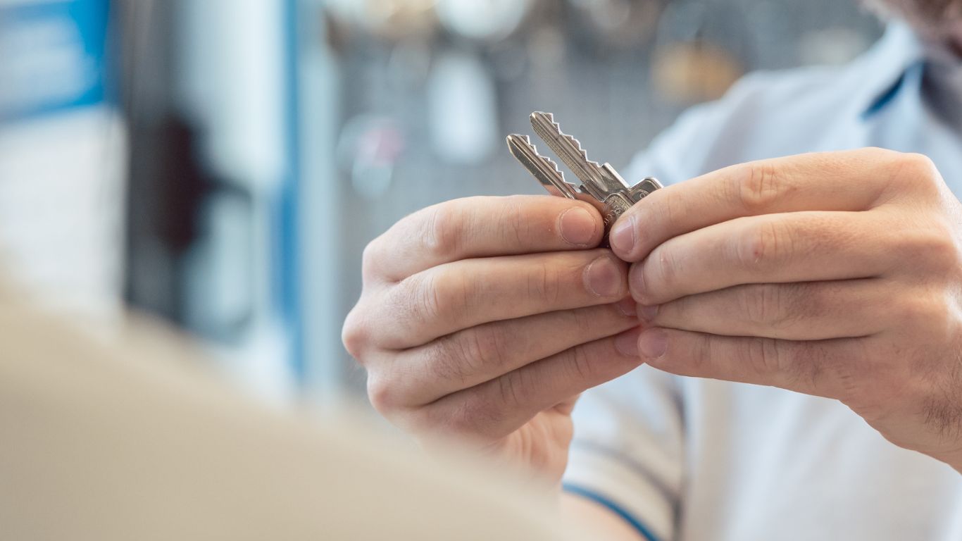 Licensed locksmith rekeying a residential lock