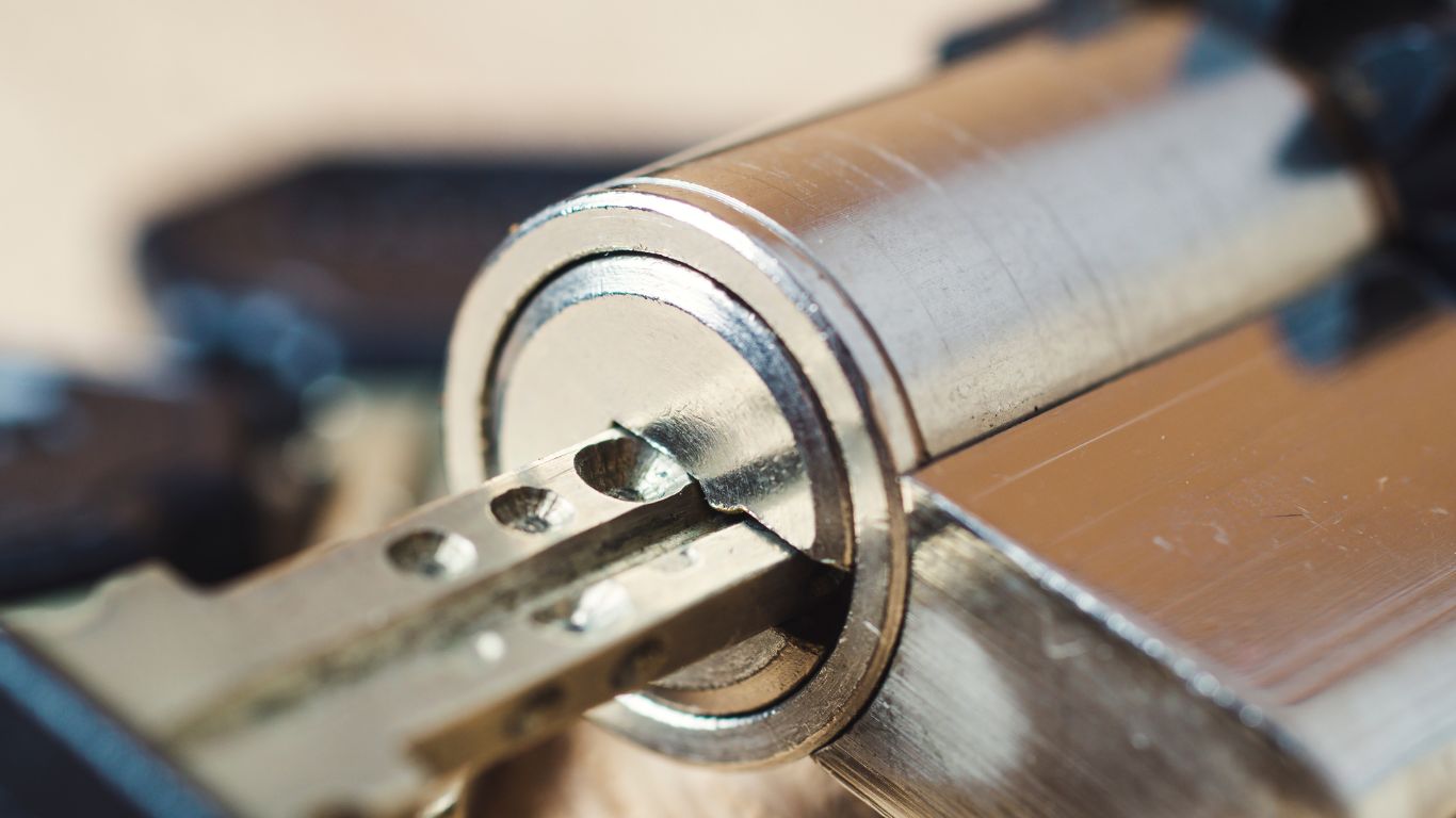 A key being cut and tested in a cylinder lock