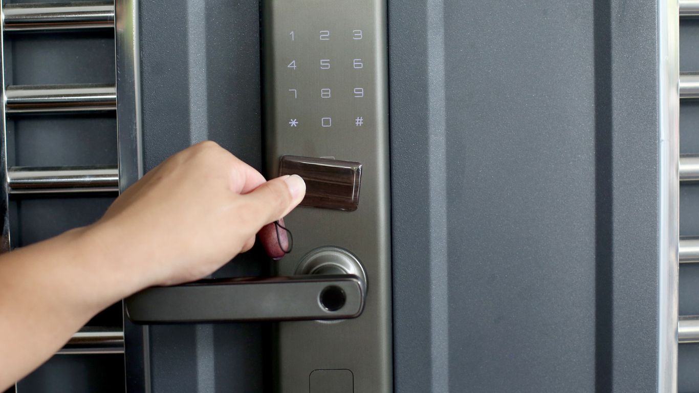 Modern keypad and fingerprint smart lock fitted to a dark front door on a contemporary Melbourne home.
